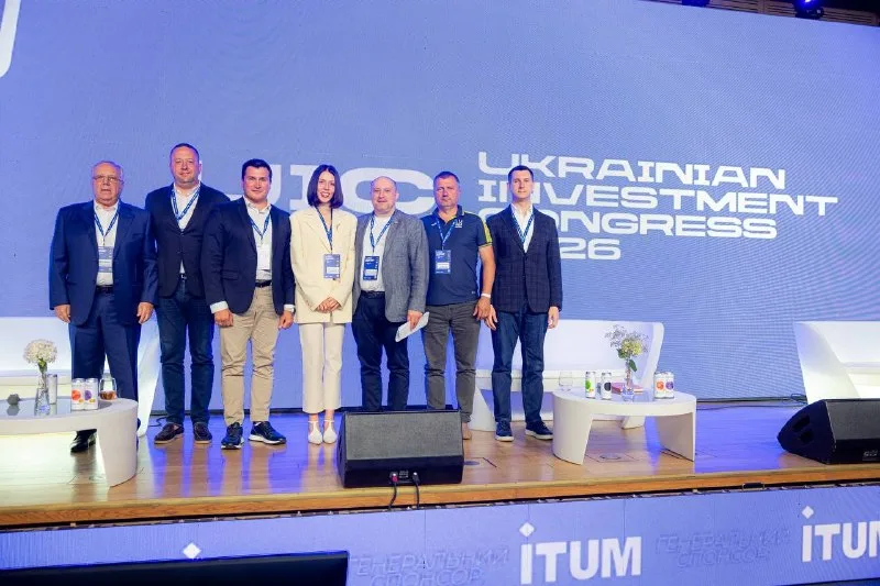 Panel discussion participants on the congress stage