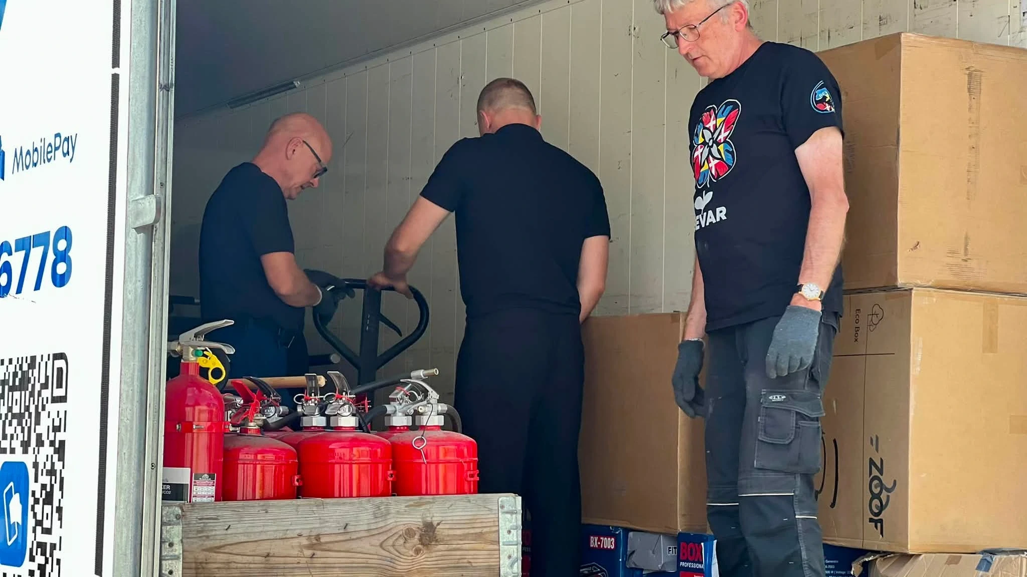 Unloading the heating equipment in Bucha. Photo: Bucha city council