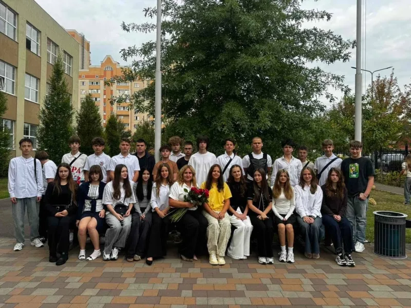 Ninth-graders with their class teacher in the yard of Lyceum No. 9
