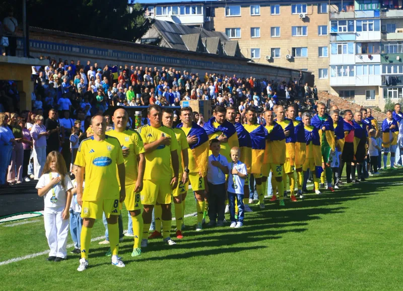 The teams walk out at the Lubny stadium