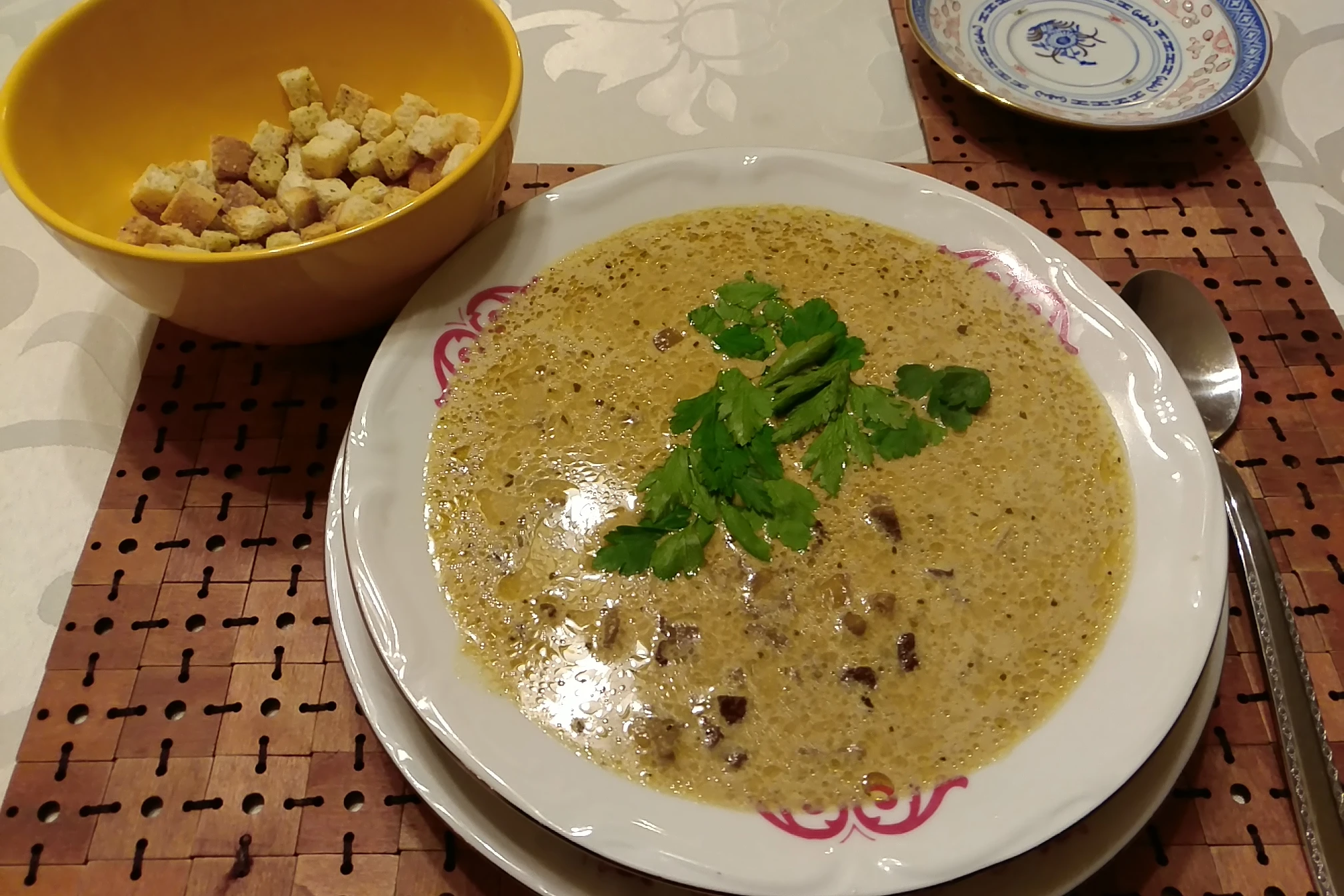 Mushroom soup with herbs and croutons