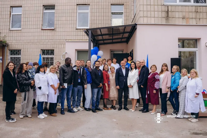 Medics and guests outside the restored premises