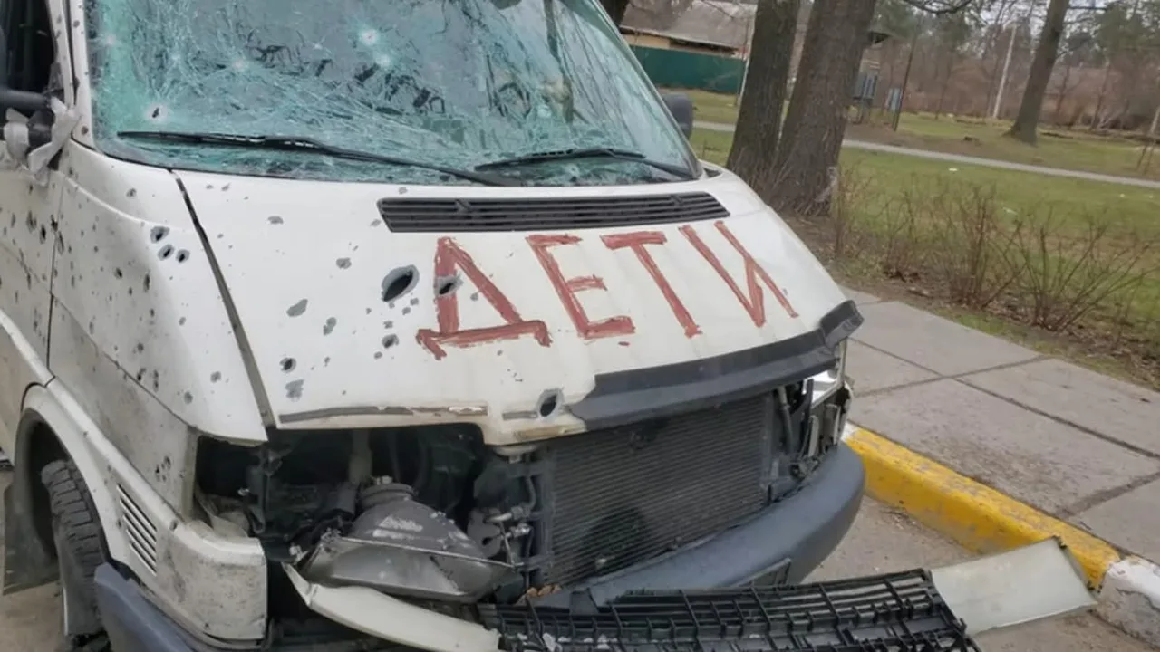A minibus riddled with bullets and marked “CHILDREN” in Bucha, 5 April 2022