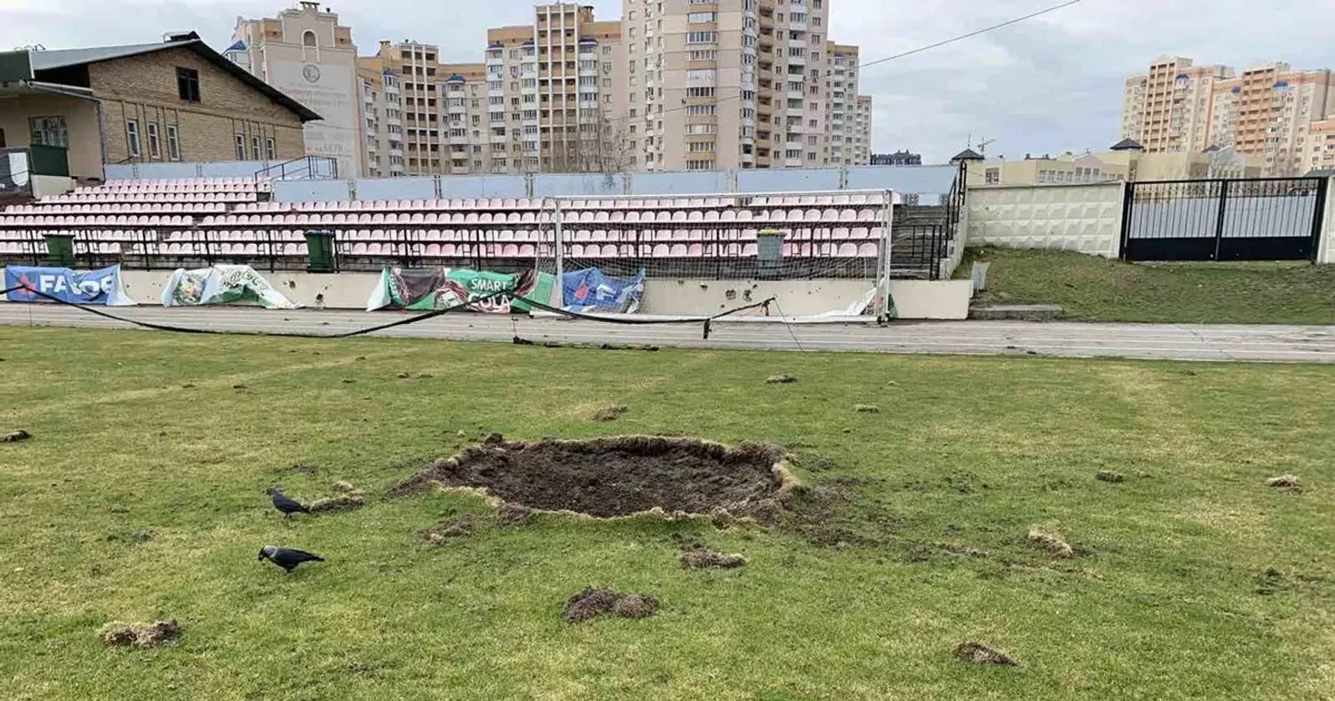 A crater on the stadium pitch