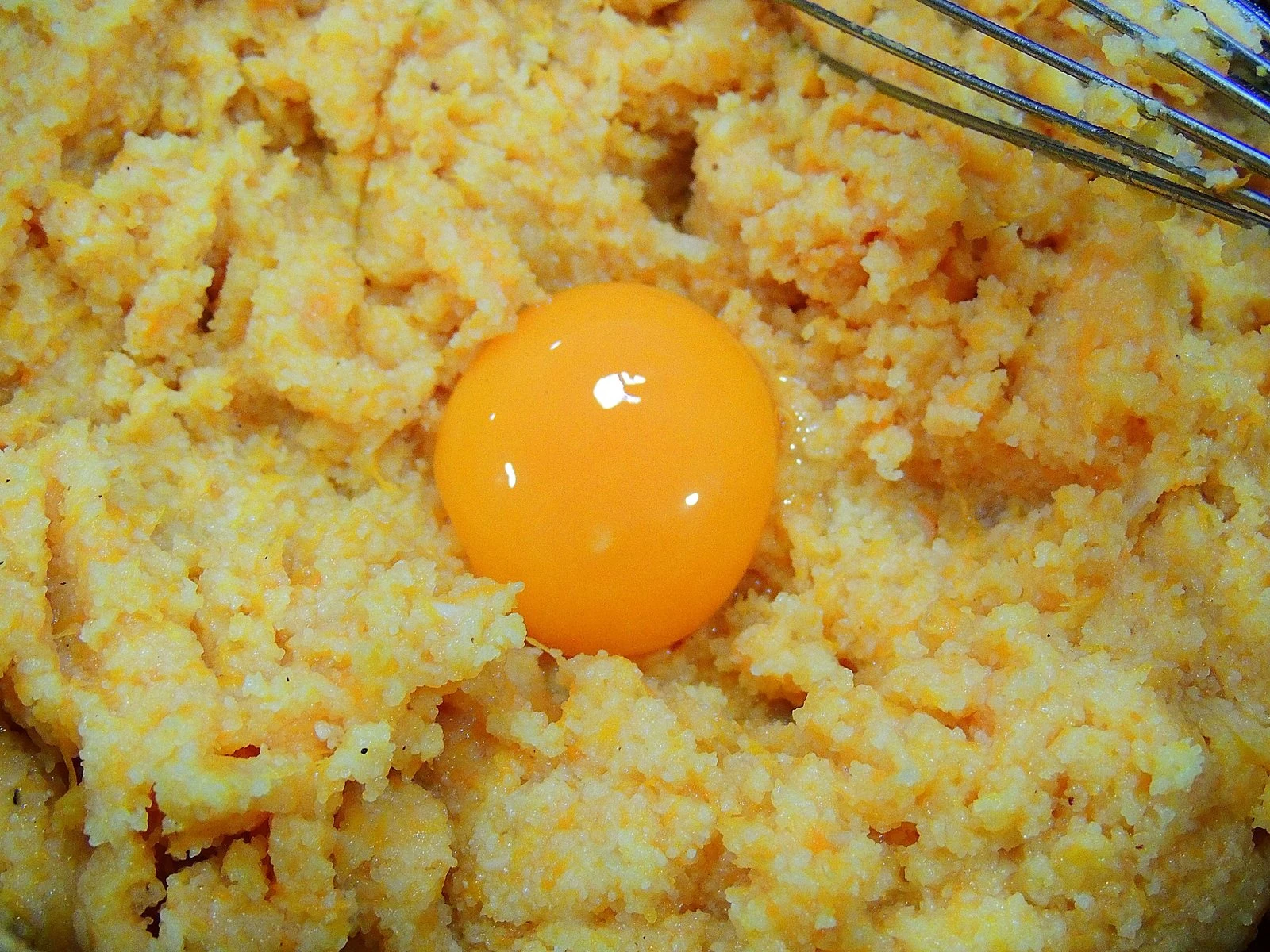 An egg yolk goes into the dough