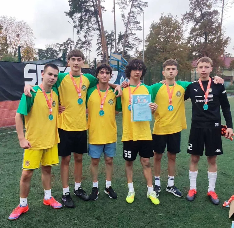 Young footballers with medals after the competition